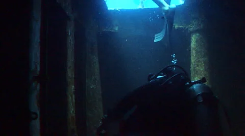Scuba divers inside a shipwreck Stock Footage 2003484