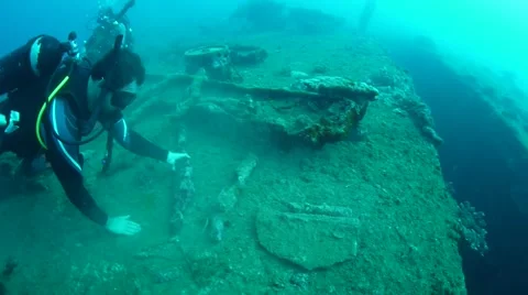 Scuba Divers a items form the USS Coolidge Stock Footage 40731676