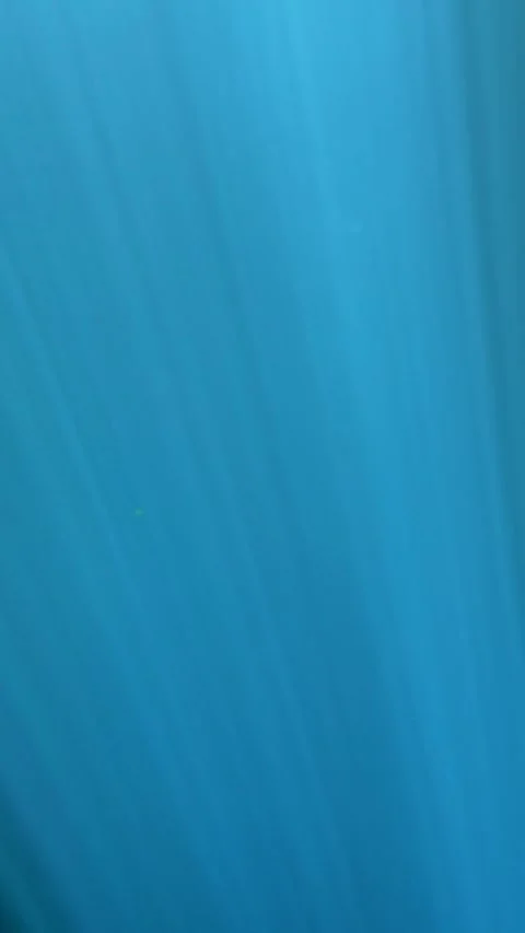 Scuba divers leaving the cenote ceiling through light rays Stock Footage 341396227
