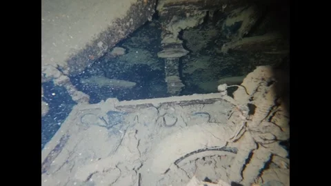Scuba diver's point of view exploring the decaying and silty interior of a Stock-Footage 335203327