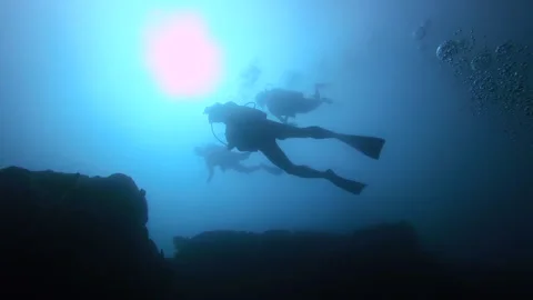 Scuba Divers silhouette Stock Footage 157994725