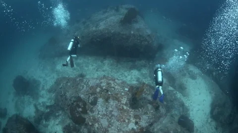 Scuba divers underwater  Stock Footage 50418243
