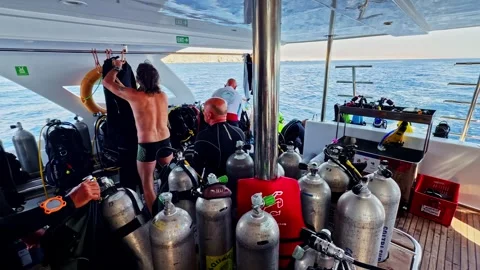 Scuba diving crew training people prepare on boat deck Stock Footage 332172699
