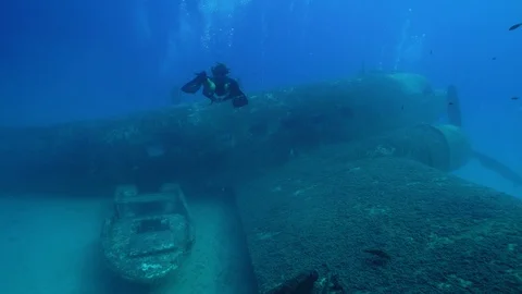 Scuba Diving to a Huge Plane Wreck Stock Footage 124066019
