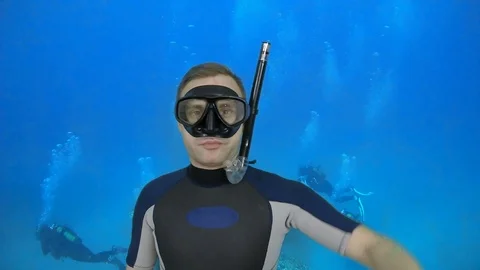 Scuba diving instructor shows signal - Descent Stock Footage 126424550