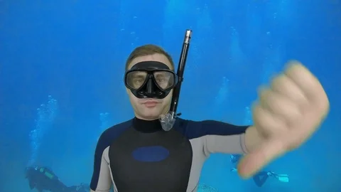 Scuba diving instructor shows signal - Descent Stock Footage 126424680