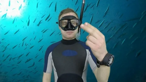 Scuba diving instructor shows signasl-Dizziness Stock Footage 126602096