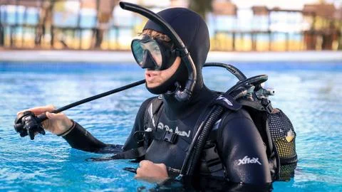 Scuba diving instructor teaching open water course (regulator breathing) Stock Photos