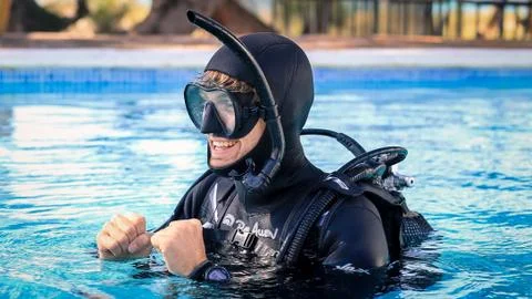 Scuba diving instructor teaching open water course (smiling) Stock Photos