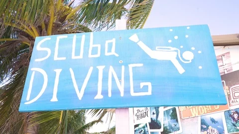 Scuba Diving Sign on the beach 動画素材 121016047