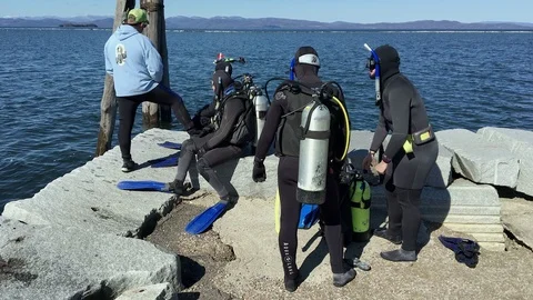 Scuba Diving Students Prepare Oxygen Tanks Before Lesson in Lake Champlain Stock Footage 89305243