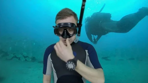 Scuba instructor pressure equalization in nose Stock Footage 124997078