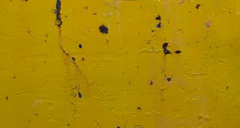 Scuffed and rusting old yellow metal background with copy space Stock Photos