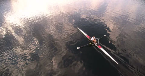 Scull rowing training at sunset. Aerial view 4k super wide Stock Footage 68319194