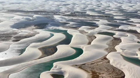 Sculpted White Dune Basins and Emerald Lagoons at Lençóis Maranhenses Stock Footage 342446001