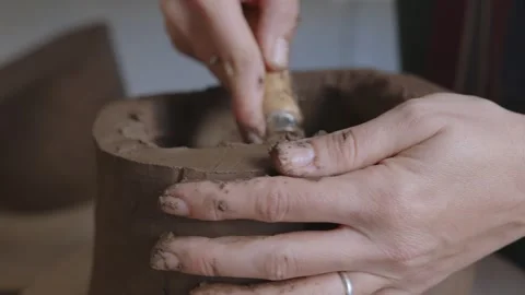 Sculpting Independence: Close-Up of a Short-Haired Artisan Crafting Clay Vase Stock Footage 255279752