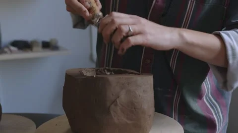 Sculpting Independence: Close-Up of a Short-Haired Artisan Crafting Clay Vase Stock Footage 255279890