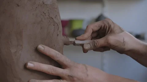 Sculpting Independence: Close-Up of a Short-Haired Artisan Crafting Clay Vase Stock Footage 256079927
