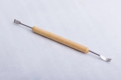 A sculpting tool on a white surface Stock Photos