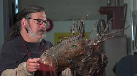 A sculptor arc working on his statue Stock Footage 53788832