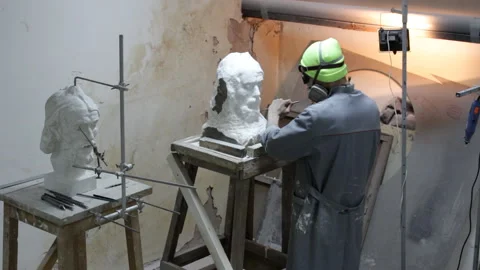 Sculptor Carving On Marble. Working with stone and sculpting statue Stock Footage 137409140