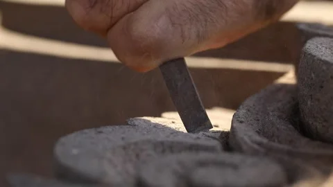 The sculptor is carving stone 8 Stock-Footage 323817424