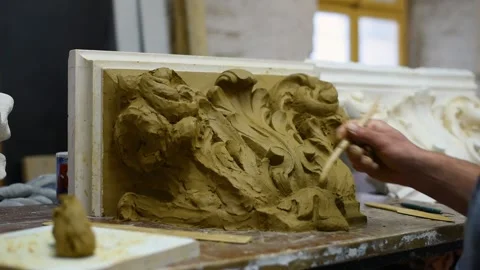 Sculptor create clay model of a Corinthian capitel with acanthus leaves Stock Footage 132211829