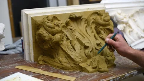 Sculptor create clay model of a Corinthian capitel with acanthus leaves Stock Footage 132212052