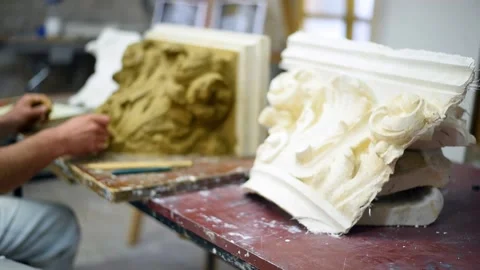 Sculptor create clay model of a Corinthian capitel with acanthus leaves Stock Footage 132212053