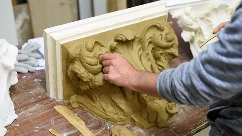 Sculptor create clay model of a Corinthian capitel with acanthus leaves Stock Footage 132212245