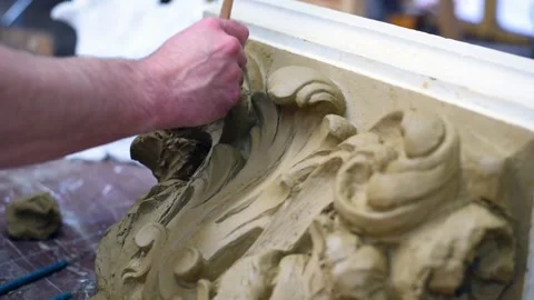Sculptor create clay model of a Corinthian capitel with acanthus leaves Stock Footage 132213025