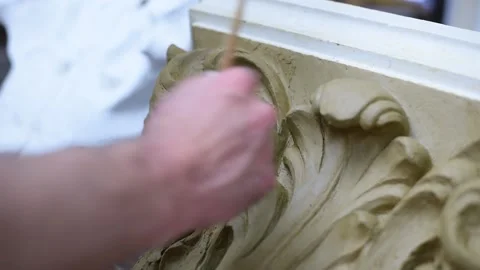 Sculptor create clay model of a Corinthian capitel with acanthus leaves Stock Footage 132213117
