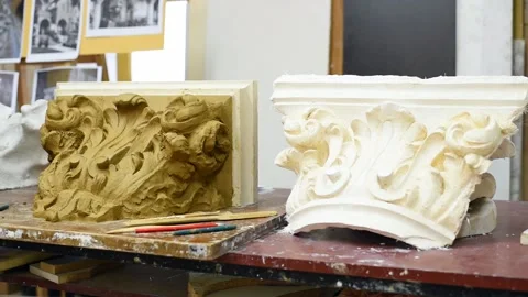 Sculptor create clay model of a Corinthian capitel with acanthus leaves Stock Footage 132213589