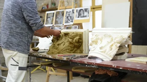 Sculptor create clay model of a Corinthian capitel with acanthus leaves Stock Footage 132213592
