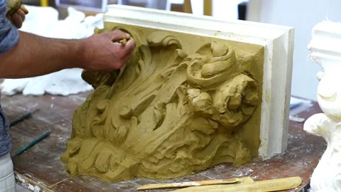 Sculptor create clay model of a Corinthian capitel with acanthus leaves Stock Footage 132213811