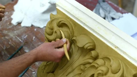 Sculptor create clay model of a Corinthian capitel with acanthus leaves Stock Footage 132213893