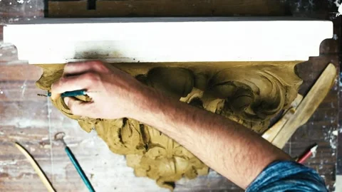 Sculptor create clay model of a Corinthian capitel with acanthus leaves Stock Footage 132214058