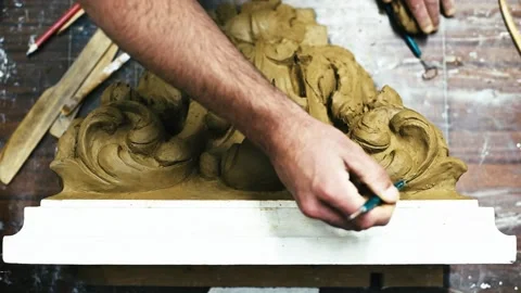Sculptor create clay model of a Corinthian capitel with acanthus leaves Stock Footage 132214063