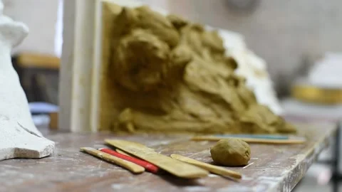 Sculptor create clay model of a Corinthian capitel with acanthus leaves Stock Footage 132214065