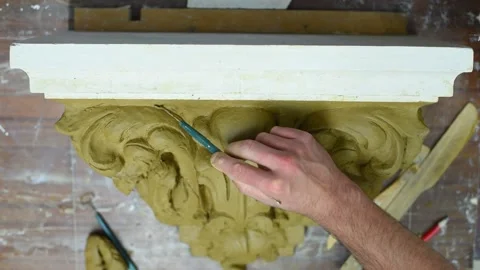 Sculptor create clay model of a Corinthian capitel with acanthus leaves Stock Footage 132214070