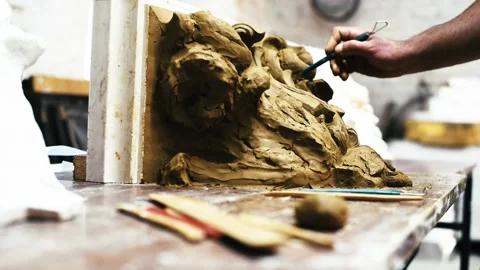 Sculptor create clay model of a Corinthian capitel with acanthus leaves Stock Footage 132214112