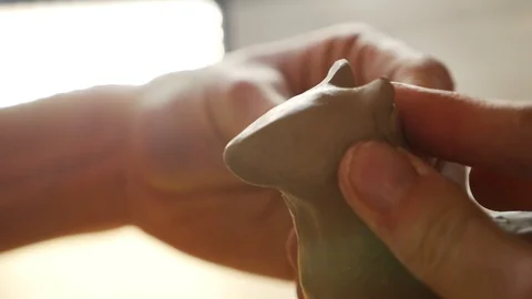 The sculptor creates a clay toy Stock Footage 102305973