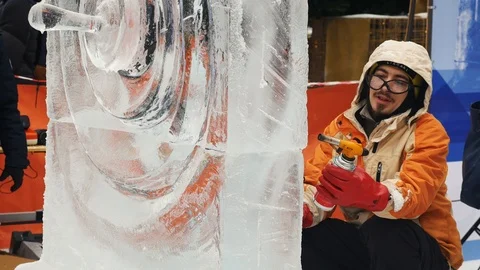 The sculptor creates an ice sculpture Stock Footage 101093494