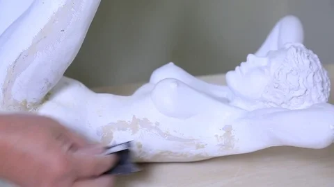 Sculptor emerying a plaster statue Stock Footage 72105626