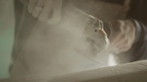 Sculptor grinding stone with an angle grinder Stock Footage 274998730