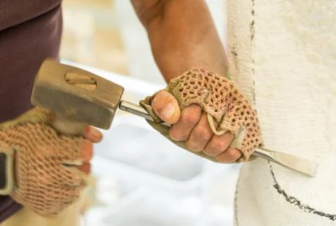 Sculptor hands while working with the tools. 스톡 사진