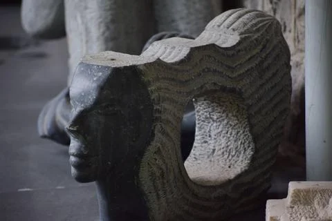 Sculptor with human face Stock Photos