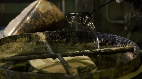 Sculptor making batch pouring toner using mixer unit Stock Footage 145618371
