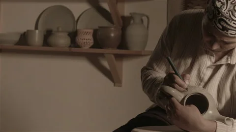 Sculptor Master Sculpt Pattern on Ceramic teapot Video stock 68113645