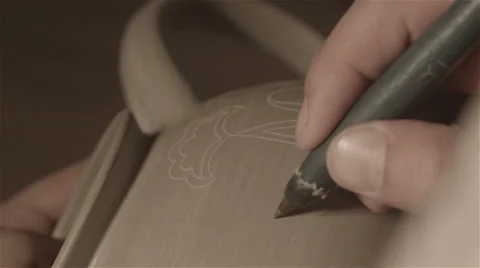 Sculptor Master Sculpt Pattern on Ceramic teapot Video stock 68114865